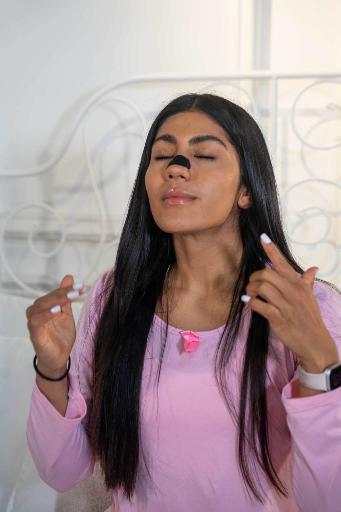 Woman relaxed with Breathe-More nasal strip